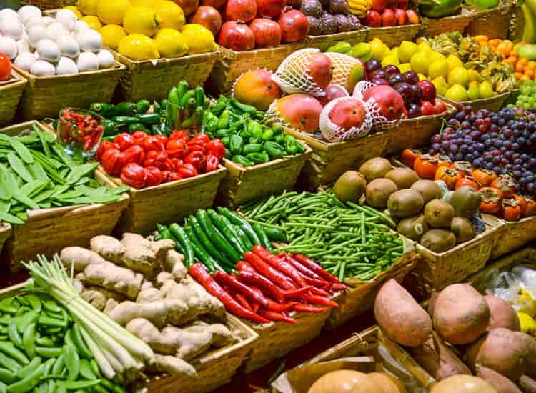 a store presentation of fruits and vegetables